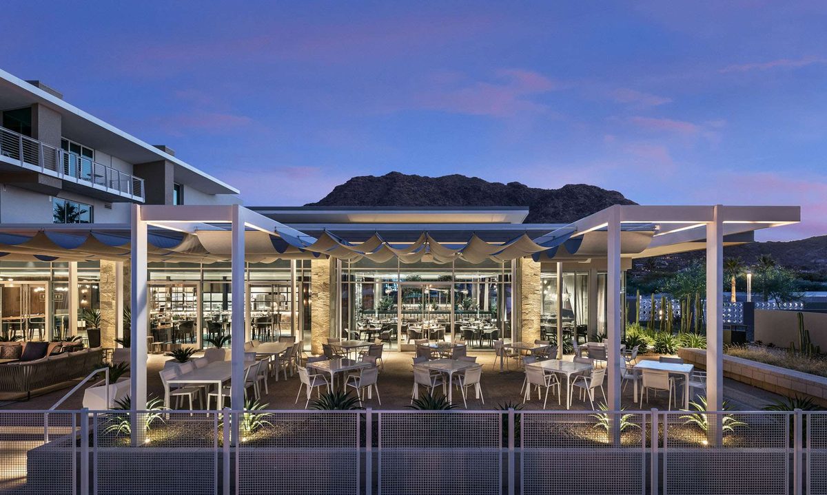Hearth '61's pergola patio at dusk with Mummy Mountain behind, at Mountain Shadows